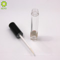 empty round clear lipstick container with black cap